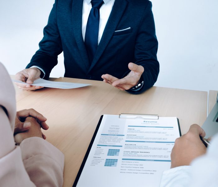 Business situation, job interview concept. Job seeker present re Business situation, job interview concept. Job seeker present resume to managers.